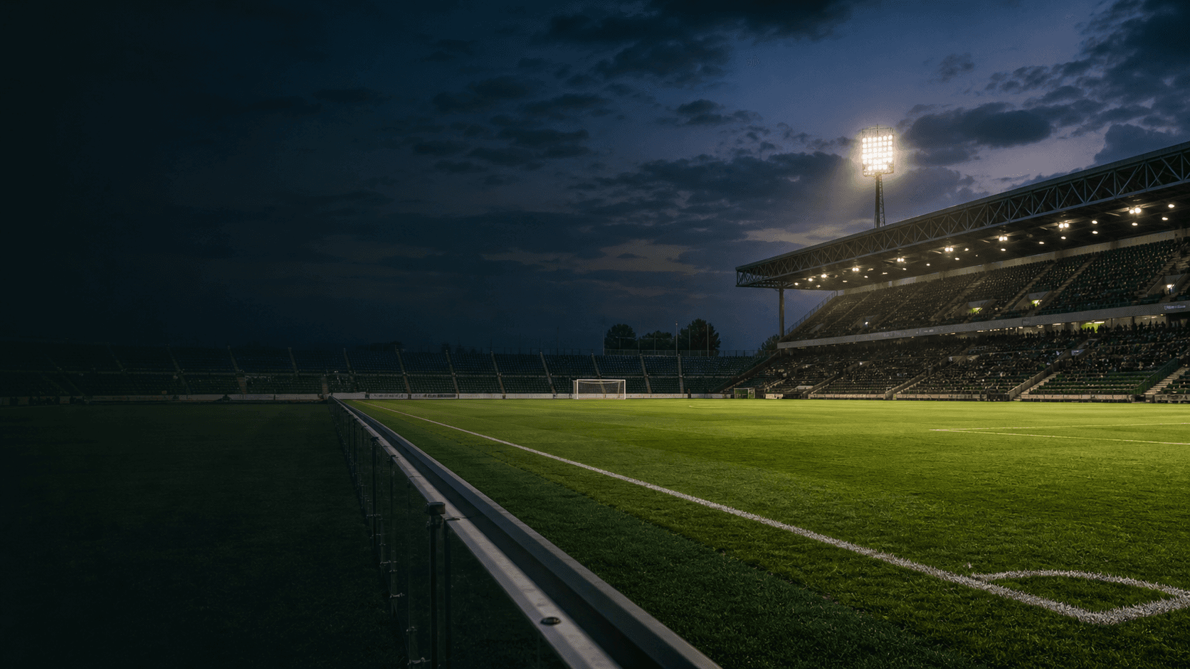 Stadio illuminato al crepuscolo, poco prima dell’inizio della partita
